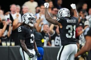 Ashton Jeanty of the Las Vegas Raiders celebrates with teammates against the Jacksonville Jaguars. The Raiders are our top play for Thursday night football picks.