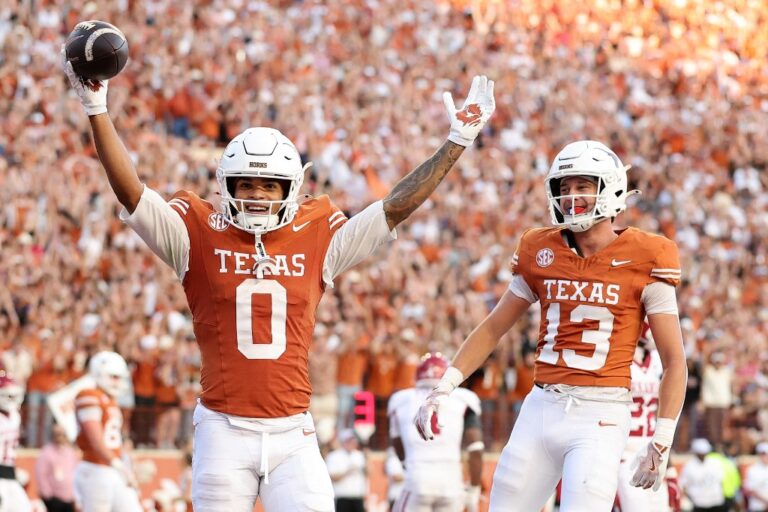 Arkansas v Texas - Oddstrader - Oddstrader Deandre Moore Jr. #0 of the Texas Longhorns, featured in our College football player props week 14, reacts after scoring a touchdown against the Arkansas Razorbacks.