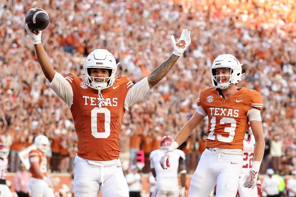Deandre Moore Jr. #0 of the Texas Longhorns, featured in our College football player props week 14, reacts after scoring a touchdown against the Arkansas Razorbacks.