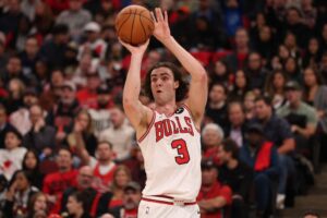 Detroit Pistons v Chicago Bulls - Oddstrader Josh Giddey, one of our NBA player props today, shoots a three pointer against the Detroit Pistons.