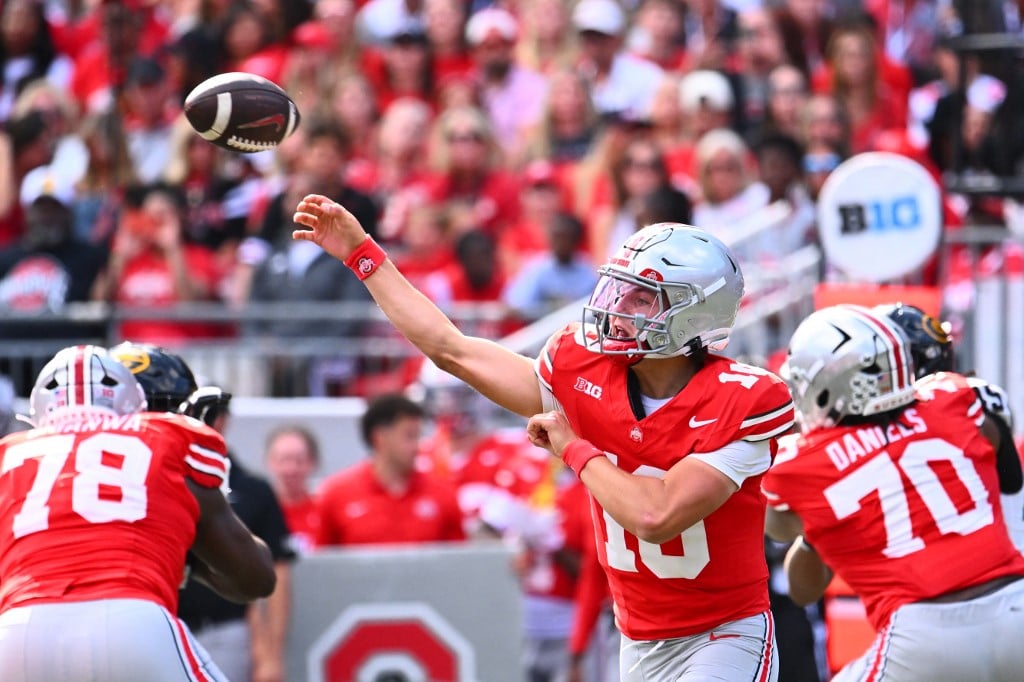 Julian Sayin of the Ohio State Buckeyes, atop contender at the Heisman Trophy odds boards, throws the ball against the Grambling State Tigers.