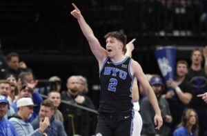 Tyler Mrus #2 of the Brigham Young Cougars points down court for ball possession during the first half of the Bad Boys Mowers Series game against the Wisconsin Badgers.