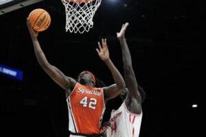 William Kyle III of the Syracuse Orange shoots against the Houston Cougars.