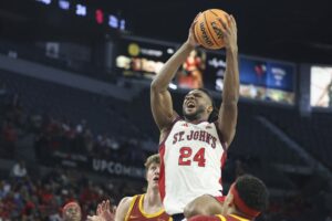 Zuby Ejiofor #24 of the St. John's Red Storm, featured in our College basketball picks today, drives to the basket against the Iowa State Cyclones.
