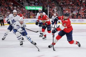 Toronto Maple Leafs v Florida Panthers - Oddstrader The cover for this NHL picks today shows A.J. Greer #10 of the Florida Panthers shooting the puck ahead of Morgan Rielly #44 of the Toronto Maple Leafs.