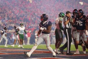 Logan Diggs #22 of the Ole Miss Rebels celebrates after scoring a touchdown during the fourth quarter of the 2025 College Football Playoff First Round Game against the Tulane Green Wave.