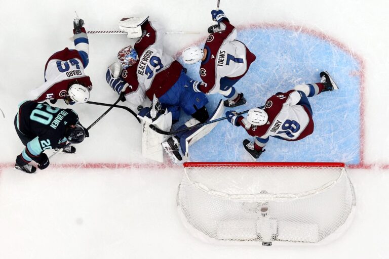 The cover for this NHL picks today article shows Mackenzie Blackwood #39 of the Colorado Avalanche making a save against Eeli Tolvanen #20 of the Seattle Kraken.