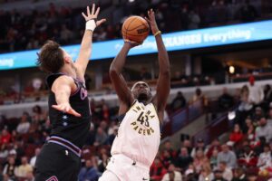 The cover for this NBA player props today article shows Pascal Siakam #43 of the Indiana Pacers shooting over Zach Collins #12 of the Chicago Bulls.