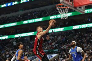 The cover for this NBA player props today article shows Tyler Herro #14 of the Miami Heat drives to the basket during the first half against the Dallas Mavericks.