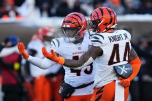 Barrett Carter #49 and Demetrius Knight Jr. #44 of the Cincinnati Bengals celebrate after a third quarter sack against the Baltimore Ravens.