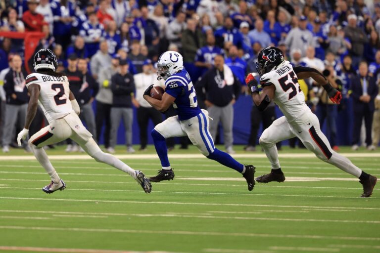 Houston Texans v Indianapolis Colts - Oddstrader - Oddstrader Jonathan Taylor #28 of the Indianapolis Colts carries the ball against Calen Bullock #2 and Danielle Hunter #55 of the Houston Texans.