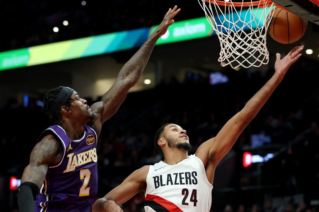Kris Murray #24 of the Portland Trail Blazers shoots against Jarred Vanderbilt #2 of the Los Angeles Lakers.