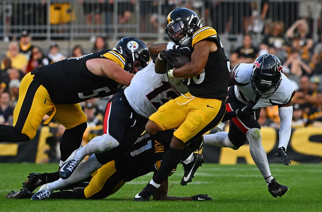 Jaylen Warren #30 of the Pittsburgh Steelers carries the ball against the Houston Texans.