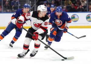 The cover for this NHL picks article today shows Arseny Gritsyuk #81 of the New Jersey Devils in action against the New York Islanders.