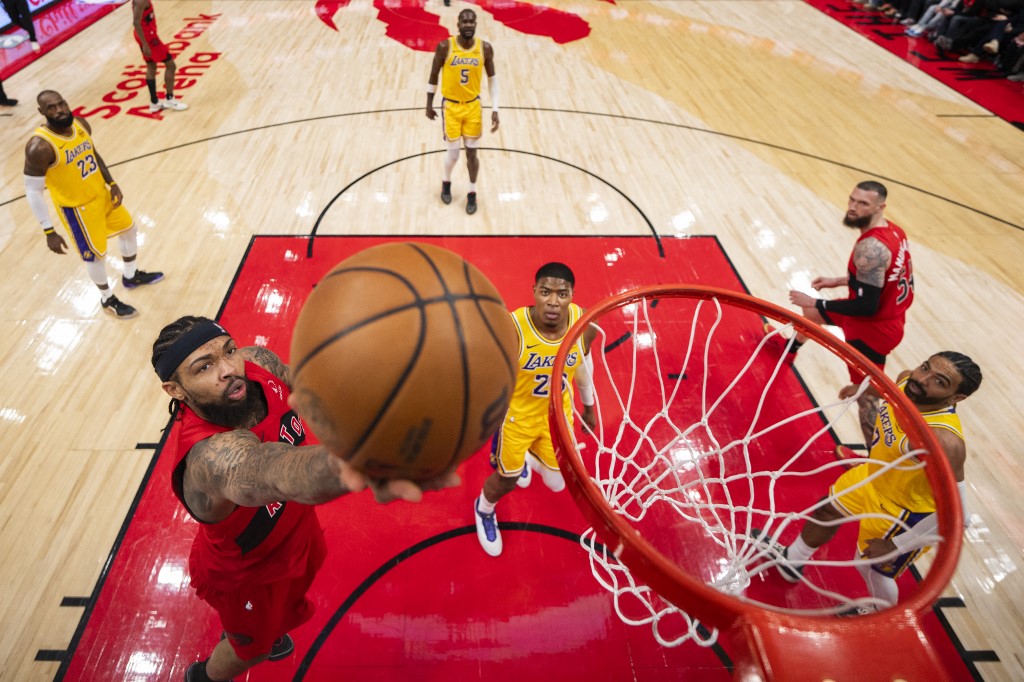 The cover for this NBA player props today article shows Brandon Ingram #3 of the Toronto Raptors goes to the basket against the Los Angeles Lakers.