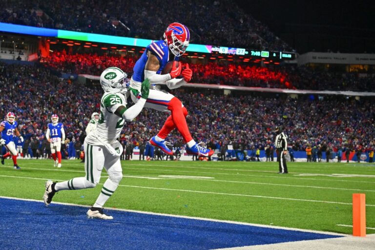 New York Jets v Buffalo Bills - NFL 2025 - Oddstrader - Oddstrader The cover for this NFL wild card picks article shows Keon Coleman #0 of the Buffalo Bills catching a pass for a successful 2-point conversion against Jarius Monroe #25 of the New York Jets.