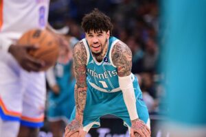 The cover for this NBA player props today article shows Lamelo Ball #1 of the Charlotte Hornets looking on during a free throw during the second half against the Oklahoma City Thunder.