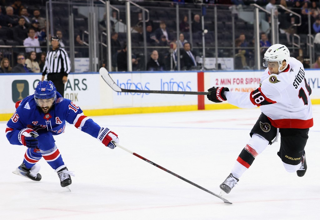 The cover for this NHL picks today article shows Tim Stützle #18 of the Ottawa Senators skating against the New York Rangers.