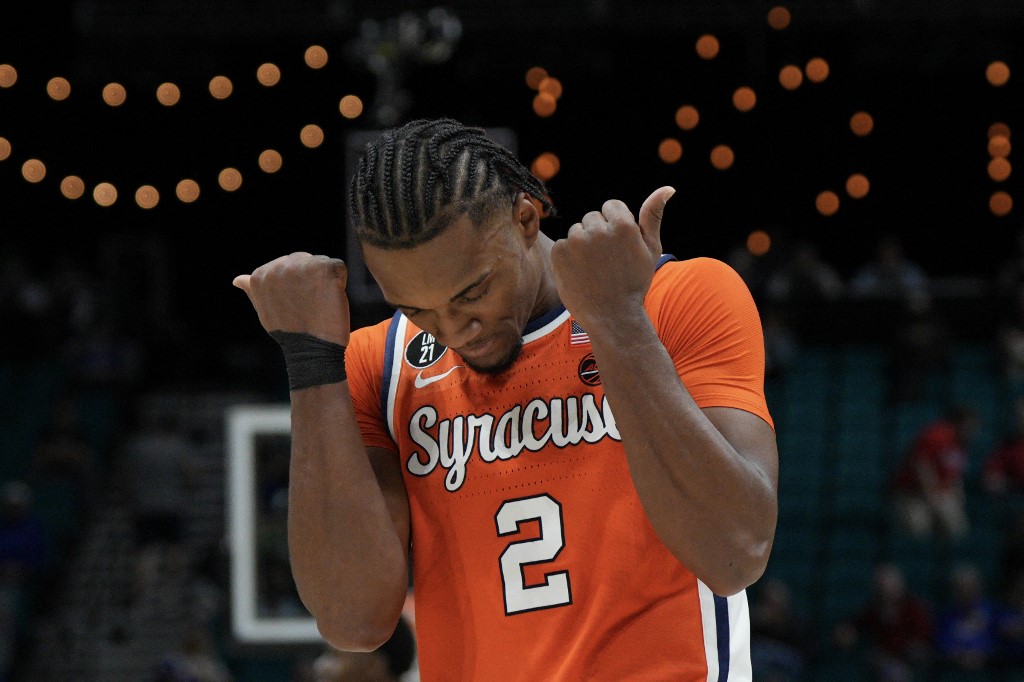 J.J. Starling #2 of the Syracuse Orange celebrates scoring against the Kansas Jayhawks.