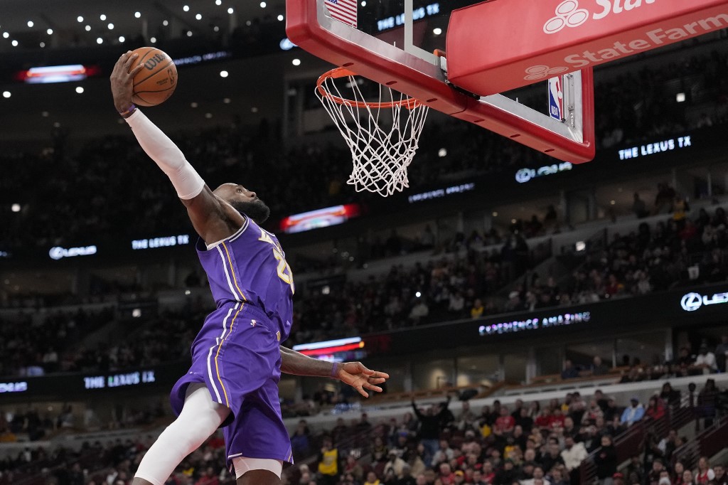 LeBron James #23 of the Los Angeles Lakers dunks the ball against the Chicago Bulls.