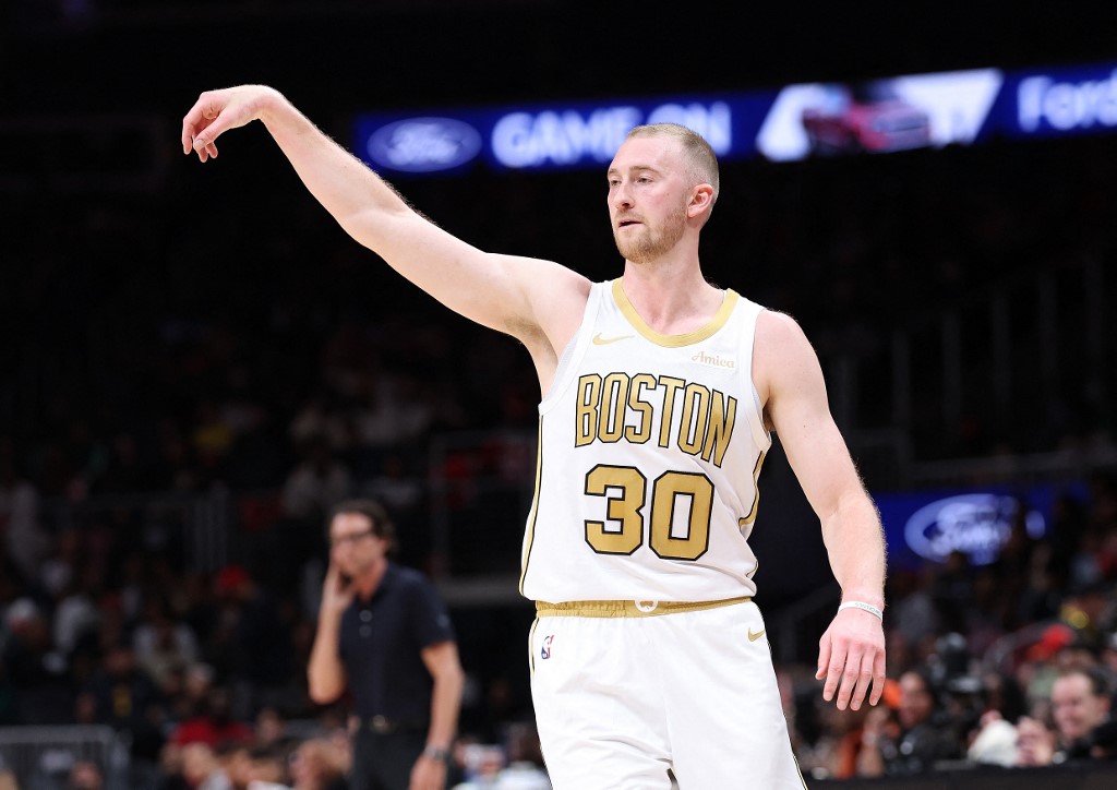 Sam Hauser #30 of the Boston Celtics shoots a three-point basket against the Atlanta Hawks.