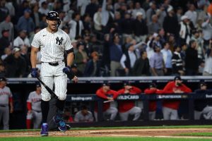 Giancarlo Stanton #27 of the New York Yankees reacts during game three of the American League Wild Card Series against the Boston Red Sox