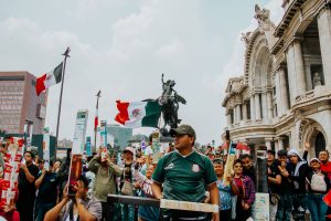 Mexico Fans-pexels-osvaldosam-28672865 - Oddstrader Photo by Osvaldo Samuel Rendon: https://www.pexels.com/photo/vibrant-mexican-celebration-at-palacio-de-bellas-artes-28672865/